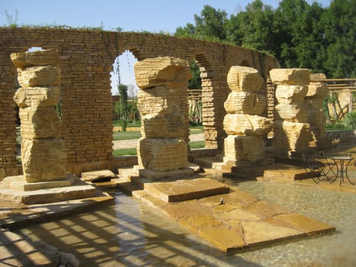 The basin with rock columns of a private garden in Riyadh